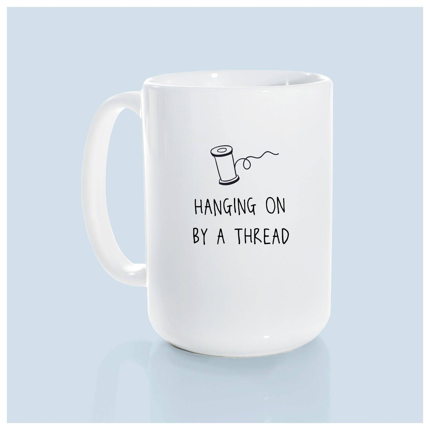 Hanging on by a thread | ceramic mug: Green