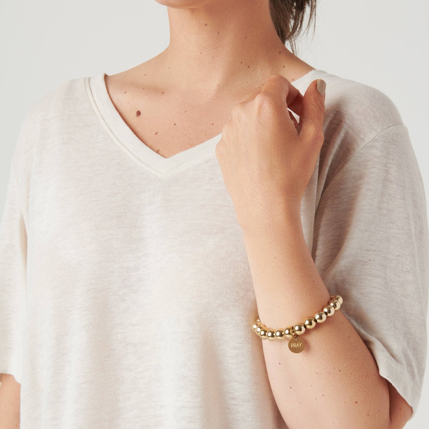 Gold Pray Serenity Stone Bracelet: PRAY