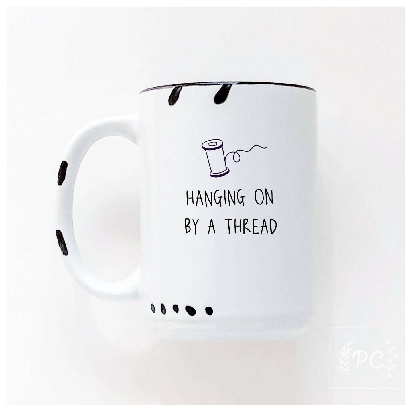 Hanging on by a thread | ceramic mug: Green